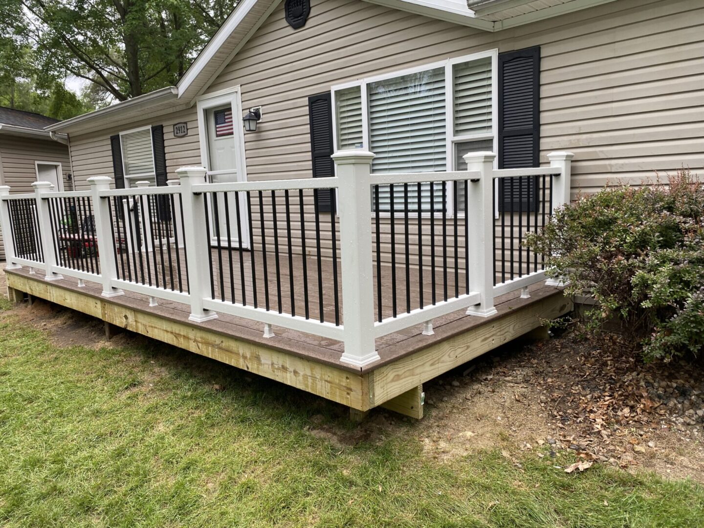 A house with a deck and railing in it